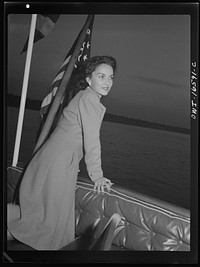 [Untitled photo, possibly related to: Detroit, Michigan. A Venetian night party at the Detroit yacht club, whose members represent the wealthier class of manufacturers and their friends. The Commodore with a girl, reviewing the fleet]. Sourced from the Library of Congress.