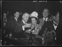 Detroit, Michigan. A Venetian night party at the Detroit yacht club, whose members represent the wealthier class of manufacturers and their friends. Couple drinking at the bar. Sourced from the Library of Congress.