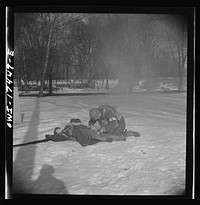 Carlisle, Pennsylvania. Demonstration before Army doctors and officer candidates at the U.S. Army medical field service school. Company aid man has marked this "wounded" man with a tag on his bayonet so he will be picked up by approaching litter bearers. Sourced from the Library of Congress.