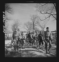 Carlisle, Pennsylvania. U.S. Army medical field service school. Officer candidates who are learning to be medical administrative officers on a road march, carrying full packs. Sourced from the Library of Congress.