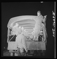 [Untitled photo, possibly related to: Carlisle, Pennsylvania. U.S. Army medical field service school. Commanding officer giving instructions to a doctor who is starting on his night problem]. Sourced from the Library of Congress.