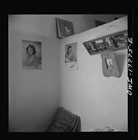 Trampas, New Mexico. Spanish-Americans like any kind of pictures; even Hollywood beauties have their place with the saints on the family wall. These pictures are in the home of Juan Lopez, the majordomo (mayor). Sourced from the Library of Congress.
