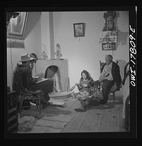 Trampas, New Mexico. The Lopez children often call on their grandfather in the evenings to hear tales of the old days when Trampas was a thriving sheep town. Sourced from the Library of Congress.