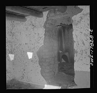 Trampas, Taos County, New Mexico. A deserted adobe in a Spanish-American village in the foothills of the Sangre de Cristo Mountains. Many generations lived in this house but lack of a cash crop caused the family to move away. Sourced from the Library of Congress.