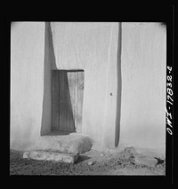 Trampas, Taos County, New Mexico. American village in the foothills of the Sangre de Cristo Mountains. Adobe construction is practical if it is kept up by replastering at least every two years. Sourced from the Library of Congress.