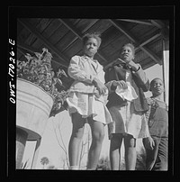 Daytona Beach, Florida. Two sisters with their brother on the front porch of the family home. Sourced from the Library of Congress.