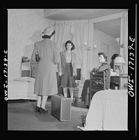 Washington, D.C. A girl employed by the U.S. government, a new arrival at a boardinghouse, being greeted by her roommates. Sourced from the Library of Congress.