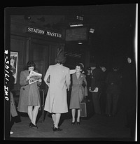 [Untitled photo, possibly related to: Wahington, D.C. Mrs. St. Ayr greeting a new girl employee of the U.S. government at the station]. Sourced from the Library of Congress.