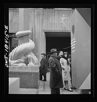 [Untitled photo, possibly related to: New York, New York. "United Nations" exhibition of photographs presented by the United States Office of War Information (OWI) on Rockefeller Plaza. Listening to broadcasts of President Roosevelt, Churchill, Stalin, and Chiang Kai-Chek, heard every half-hour from a loudspeaker at one end of the frame containing the Atlantic charter. This frame is surrounded by four statues of the four freedoms]. Sourced from the Library of Congress.