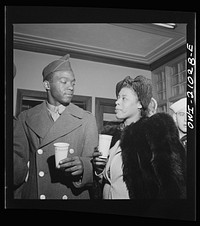 Washington, D.C. Part of the line waiting to board one of the special buses for servicemen leaving the Greyhound terminal on Sunday nights. Girls stand in line with soldiers and sailors, keeping them company until they leave. Sourced from the Library of Congress.