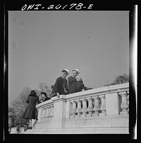 Washington, D.C. Sailors sitting on a monument in front of the Capitol on Sunday. Sourced from the Library of Congress.