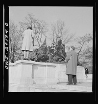 Washington, D.C. Taking pictures on the steps of a monument in front of the Capitol on a Sunday afternoon. Sourced from the Library of Congress.
