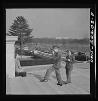 Washington, D.C. Soldier taking pictures on the steps of the National Gallery of Art on a Sunday afternoon. Sourced from the Library of Congress.