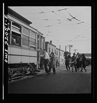Baltimore, Maryland. Workers rushing to catch the trolley home at four p.m.. Sourced from the Library of Congress.