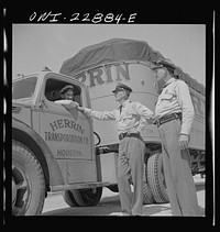 Franklin, Louisiana. State highway patrolmen talking with Jean Broussard, a Cajun truck driver. Sourced from the Library of Congress.