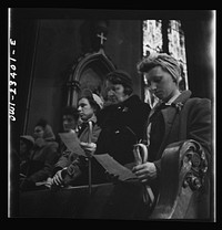 [Untitled photo, possibly related to: Buffalo, New York. Women factory workers attending mass at nine a.m. Sunday directly after working the third shift]. Sourced from the Library of Congress.