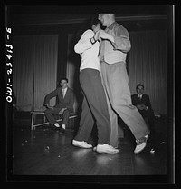 [Untitled photo, possibly related to: Buffalo, New York. At the swingshift dance held weekly from midnight to four a.m. at the Main-Utica ballroom]. Sourced from the Library of Congress.