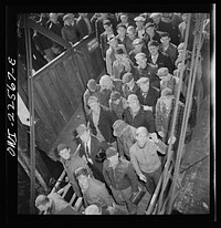 Baltimore, Maryland. Bethlehem Fairfield shipyard workers boarding a former Wilson Line pleasure boat, now used for workers' transportation, to get back to Baltimore from the second shift. Sourced from the Library of Congress.