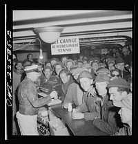 Baltimore, Maryland. Eighteen hundred workers are carried from the Bethlehem Fairfield shipyard to Baltimore on a former Wilson Line pleasure boat. The trip takes twenty minutes drinks. Sourced from the Library of Congress.