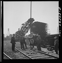 Bethlehem-Fairfield shipyards, Baltimore, Maryland. Steam crane operating in a stockyard. Sourced from the Library of Congress.