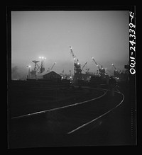 Bethlehem-Fairfield shipyards, Baltimore, Maryland. A night view looking toward the ways. Sourced from the Library of Congress.