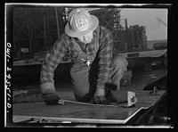 Richmond, California. Permanente Metals Corporation, shipbuilding division, yard number two. V. De Martini has worked in the yard for ten months. He was born in Italy, and has been in the United States thirty-four years. Sourced from the Library of Congress.