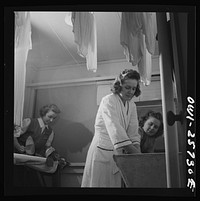 Arlington, Virginia. Washing clothes in one of the laundry rooms at Idaho Hall, Arlington Farms, a residence for women who work in the government for the duration of the war. Sourced from the Library of Congress.
