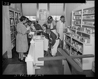 D-S store at the Douglas-Simmons Elementary School, Washington, D.C. The children are using the store to learn how to shop under price control. Sourced from the Library of Congress.