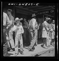 [Untitled photo, possibly related to: San Augustine, Texas. People on the main street on Saturday afternoon]. Sourced from the Library of Congress.