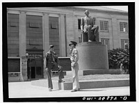 San Augustine, Texas. Two soldiers home on furlough talking in front of the courthouse. Sourced from the Library of Congress.
