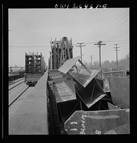 Bethlehem-Fairfield shipyards, Baltimore, Maryland. Steel sections on railroad cars. Sourced from the Library of Congress.