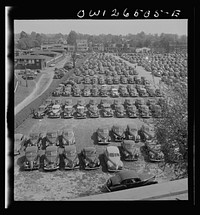 [Untitled photo, possibly related to: Pimlico racetrack, near Baltimore, Maryland. Parked cars at Pimlico in spite of gas ration]. Sourced from the Library of Congress.