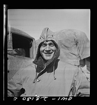Somewhere in Iran. Jack Tchernawitz, a Russian-born United States Army Major of New York, New York, wearing his parka at a delivery point of American supplies to Russia. Major Tchernawitz is the Russian-speaking liason officer of the United States Army forces here. Sourced from the Library of Congress.