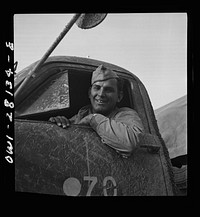 Private First Class Leonard L. Sweeney, of Winooski, Vermont. A mechanic in civilian life, he is serving as a truck driver with the United States Army overseas. Sourced from the Library of Congress.