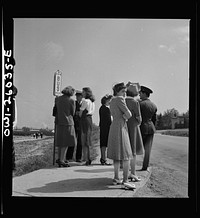 Arlington, Virginia. Waiting for the bus at Arlington Farms, a residence for women who work in the U.S. government for the duration of the war. Sourced from the Library of Congress.