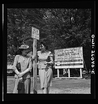 [Untitled photo, possibly related to: Arlington, Virginia. Waiting for the bus at Arlington Farms, a residence for women who work in the U.S. government for the duration of the war]. Sourced from the Library of Congress.