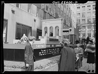 New York, New York. Spectators attracted by the exhibits at the Nature of the Enemy show, put up by the United States (Office of War Information) at Rockefeller Plaza. Sourced from the Library of Congress.