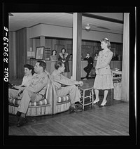 Arlington, Virginia. The main lounge in Idaho Hall, Arlington Farms, a residence for women who work in the United States government for the duration of the war. Sourced from the Library of Congress.