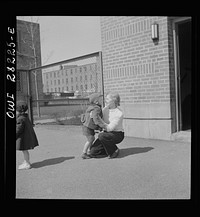 Buffalo, New York. Lakeview nursery school for children of working mothers, operated by the Board of Education at a tuition fee of three dollars weekly. Mother coming to pick up her child after work. Sourced from the Library of Congress.
