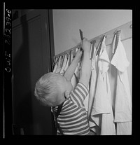Buffalo, New York. Lakeview nursery school for children of working mothers, operated by the Board of Education at a tuition fee of three dollars weekly. Each child has own comb and towel, washes himself and combs his won hair. Sourced from the Library of Congress.