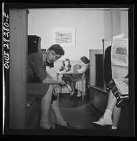 [Untitled photo, possibly related to: Arlington, Virginia. The main lounge at the Idaho Hall, Arlington Farms, a residence for women who work in the United States government for the duration of the war]. Sourced from the Library of Congress.