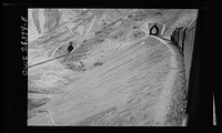 Route of the Iranian state railway train (right) heads into a tunnel. Notice the several tunnel entrances shown in this photo. Sourced from the Library of Congress.