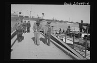Major General Lewis Brererton inspecting port facilities handling ships bringing supplies for the aid of Russia somewhere in the Middle East. Sourced from the Library of Congress.