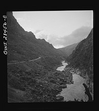 Somewhere in the Persian corridor. A United States Army truck convoy carrying supplies for Russia on a mountain road which winds along the mountainside with a sheer drop into the gorge on one side. Sourced from the Library of Congress.