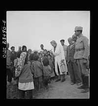 Teheran, Iran. Mrs. Louis Dreyfus, wife of the United States Minister to Iran, talking with native children. Sourced from the Library of Congress.