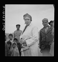Teheran, Iran. Mrs. Louis Dreyfus, wife of the United States Minister to Iran, visiting a poor section of the city. Sourced from the Library of Congress.