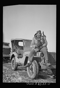 Somewhere in the Persian corridor. A United States Army truck convoy carrying supplies for Russia. OWI (Office of War Information) photographer Nick Parrino on the jeep which he rode in making a photographic record of the first run by an all-American convoy. Sourced from the Library of Congress.