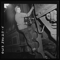 Pitcairn, Pennsylvania. Mrs. Mary Ankrom, twenty-eight, mother of six children, employed at the Pennsylvania Railroad engine house as a locomotive preparer, earning fifty-eight cents per hour. Her father takes care of her children while she is working. Sourced from the Library of Congress.