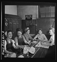 [Untitled photo, possibly related to: Pitcairn, Pennsylvania. Lunch hour in the women's locker at the yards of the Pennsylvania Railroad. Left to right: Bertha Carlotta, twenty-nine, a machinist testing axles; Anna Plecenik, twenty-four, a machinist's helper, working a drill press; Mary Stefanski, thirty-seven, a smith's helper; Cecelia Wadkowski, thirty-five, a machinist operating a turret lathe; and Susan Topolosky, thirty-two, a machinist's helper operating a radial dial press]. Sourced from the Library of Congress.
