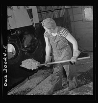 Pitcairn, Pennsylvania. Miss Mary DaVanzo, twenty-two, employed at the Pennsylvania Railroad steel car shop boiler room as a stationary firemen's helper, earning seventy-two cents per hour. She lives on a farm in nearby Delmont and was formerly a waitress in the Mercy Hospital, Pittsburgh. Sourced from the Library of Congress.
